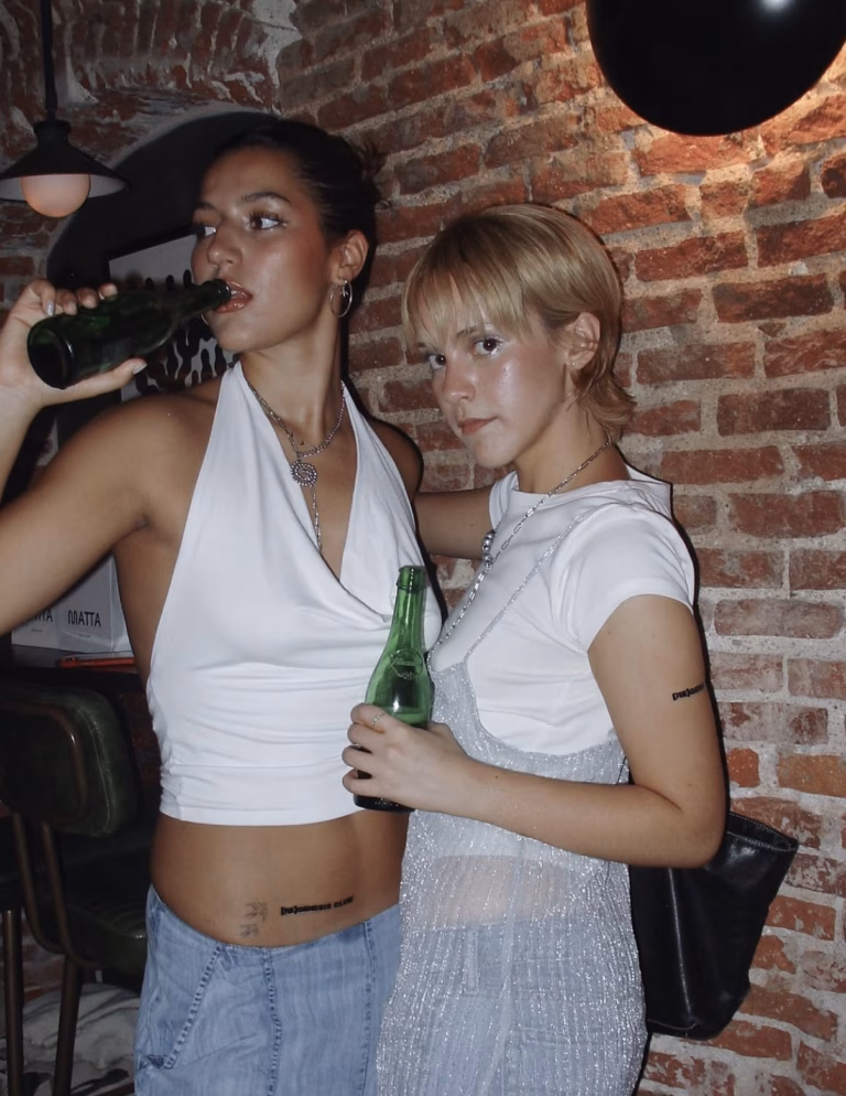 Commercial Brand Shoot: Regenesis Club with Pamela Negrín and Eva Mavis posing at the release party.